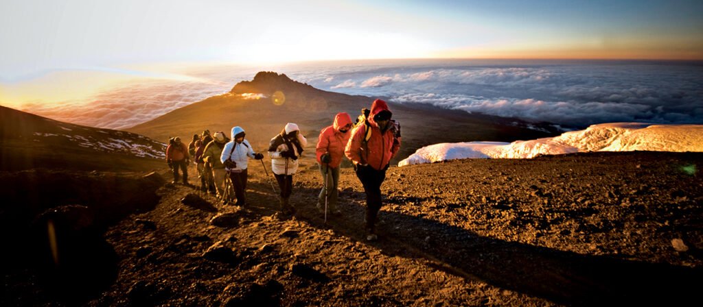 Sarafu travel Hero climbing mount kilimanjaro